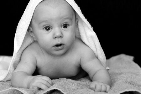 Baby Covered by White Towel Grayscale Photography photo