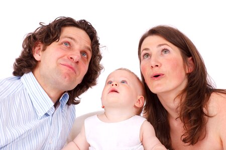 Close-up Photography of Woman, Man, and Baby photo