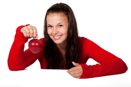 Smiling Woman Holding Red Apple photo