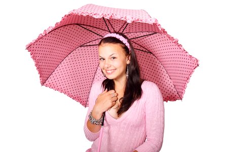 Smiling Woman Wearing Pink Shirt Under Pink-and-black Umbrella photo