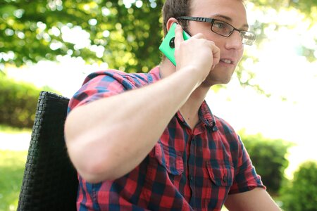 Man Placing His Phone on His Right Ear photo