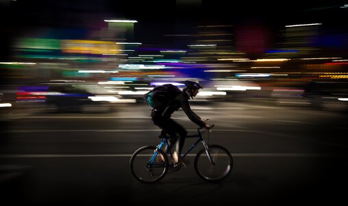Photo Lapse Photo of Man Riding a Road Bicycle photo