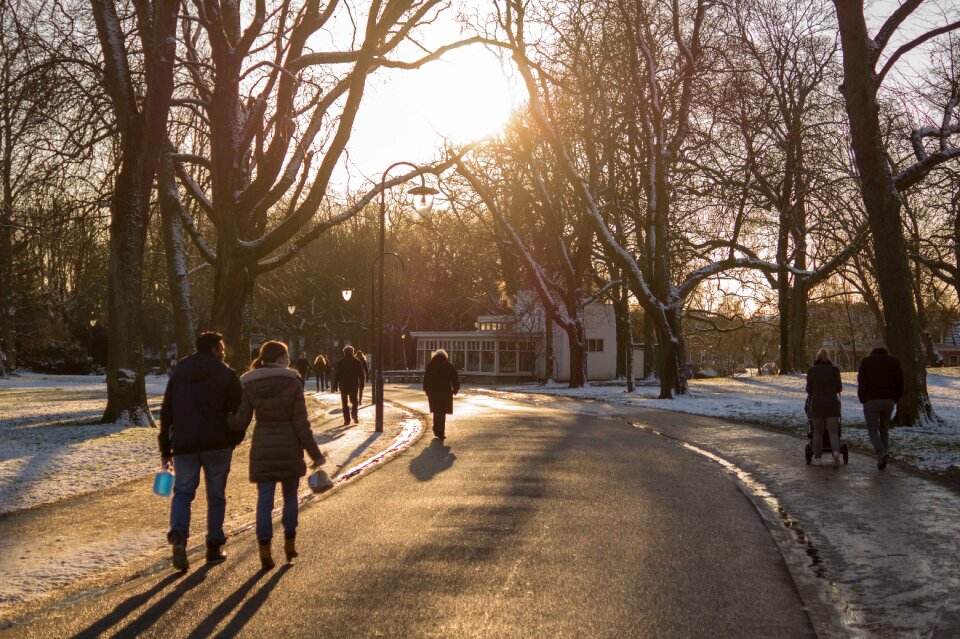 People Walking on Road during Sunset