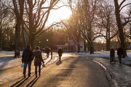 People Walking on Road during Sunset photo