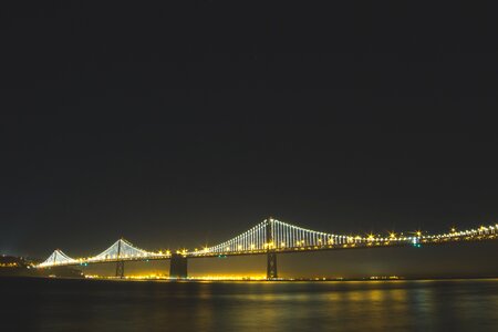 Lighted Bridge at Nighttime photo