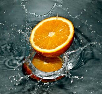 Time Lapse Photography of Orange Fruit on Water
