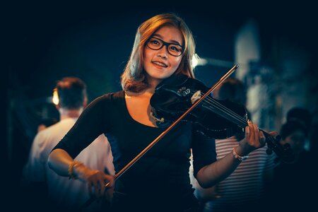 Woman Playing Black Violin photo