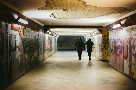 People Walking on Subway With Lights Turned on photo