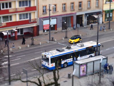 Blue and White Bus on Bus Stop during Daytime
