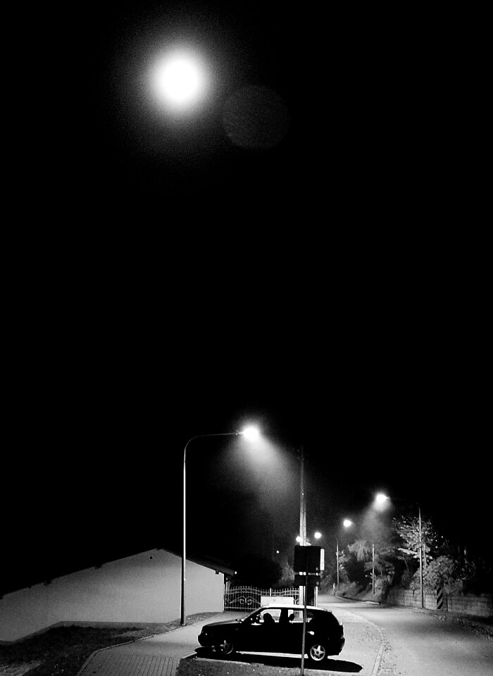 Full Moon Above 5 Door Hatchback Near Electrical Post
