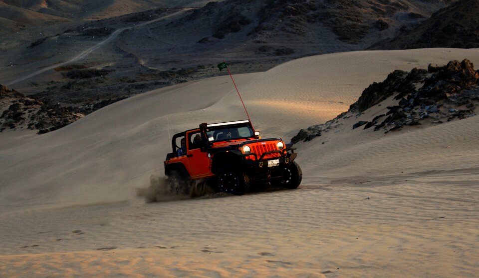 Red Jeep Wrangler on White Covered Field