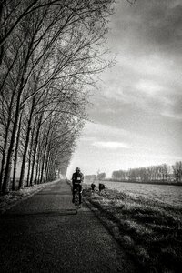 Grayscale of Person Riding Bike photo