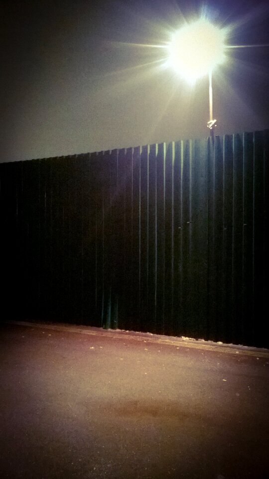 Black Fence Below Gray Light
