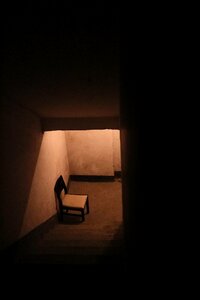 Black and White Wooden Chair Near Stair