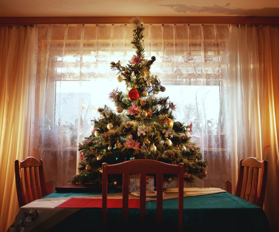 Green Christmas Tree With Ornaments on Table