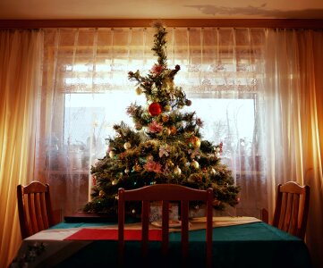 Green Christmas Tree With Ornaments on Table photo