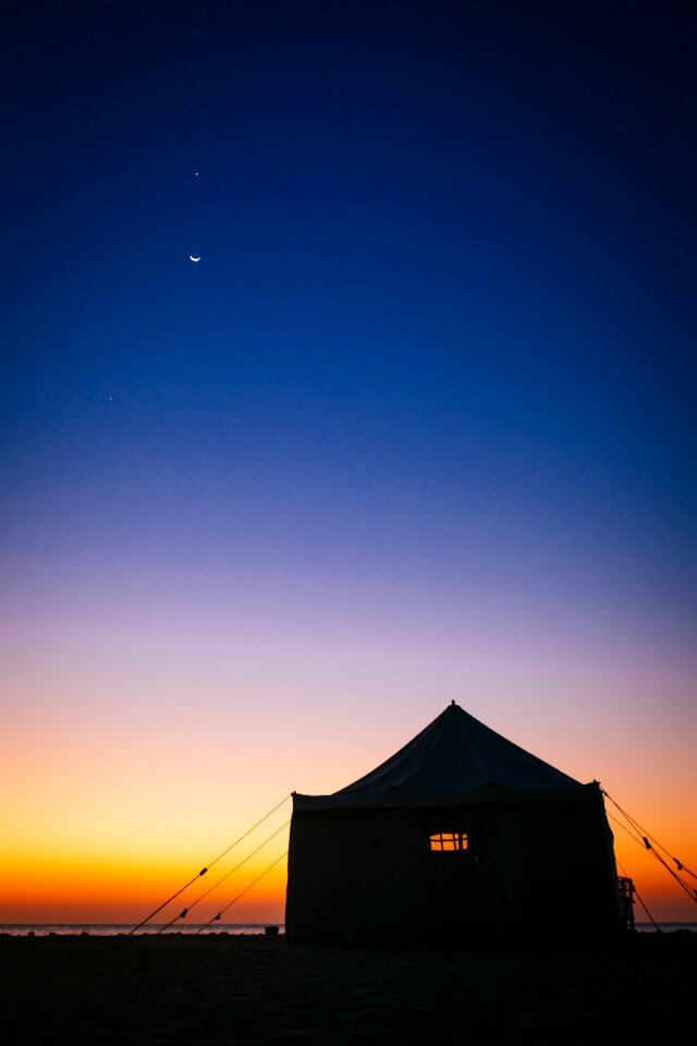 Camping Tent Near Sea Under Blue Sky during Sunset
