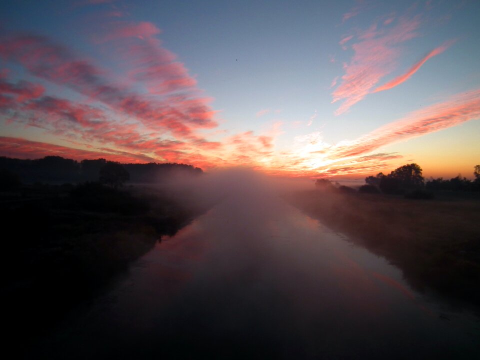 Sun Setting over White Clouds