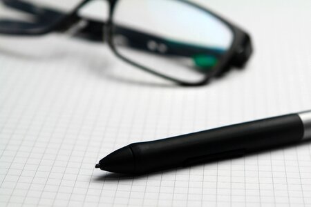 Free stock photo of close-up, eyeglasses, graphing paper photo
