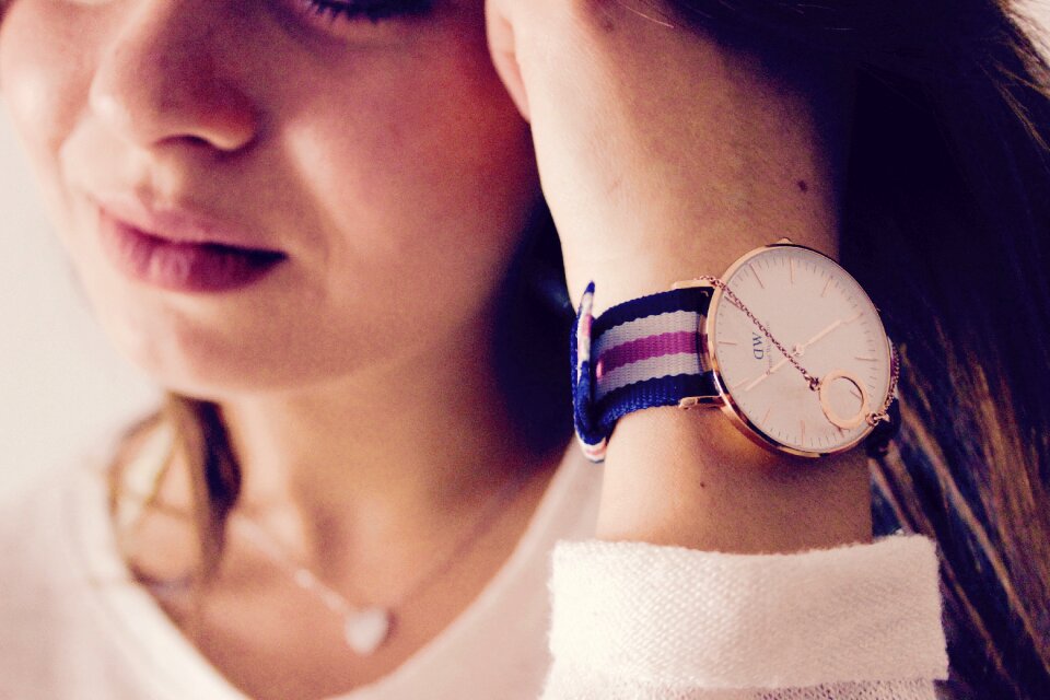 Woman Wearing Round Gold-colored Daniel Willington Analog Watch