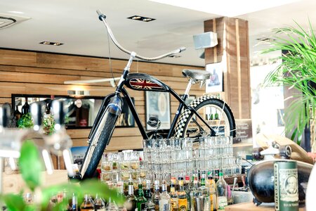 Black Cruiser Bicycle on Bar Table