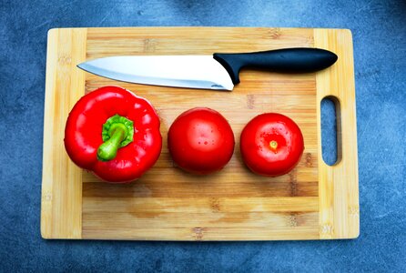 Bell Pepper and Knife on Brown Wood photo