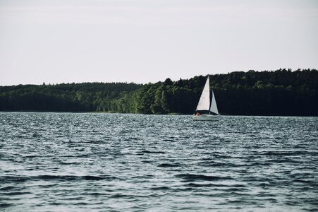 White Sailboat Sail on Body of Water during Daytime photo