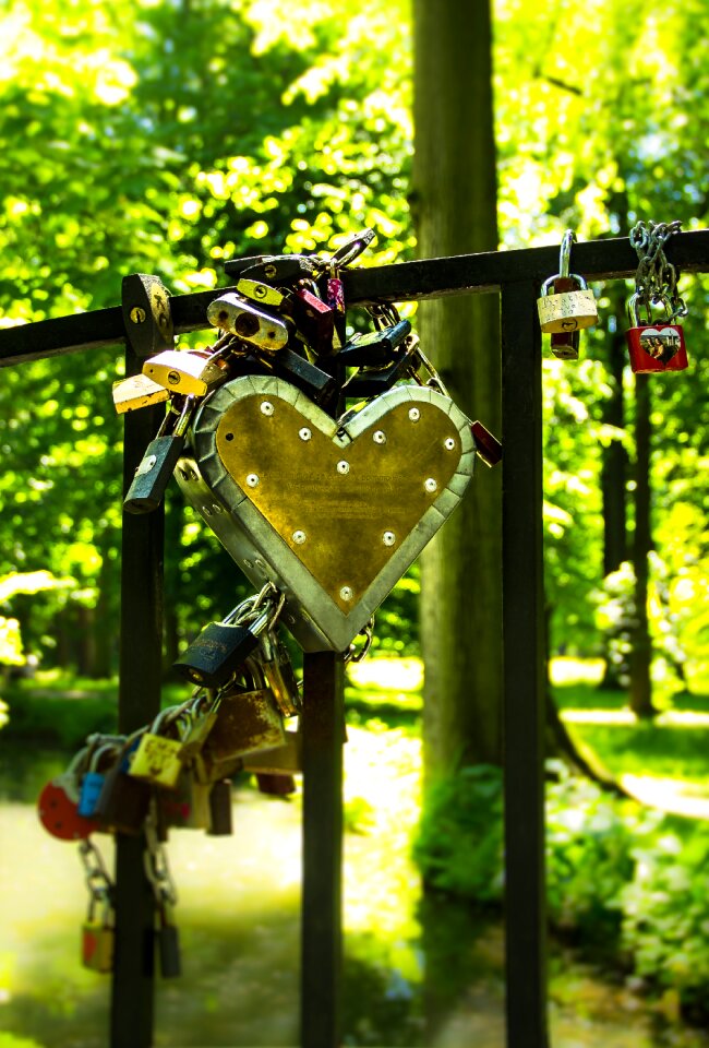 Stainless Steel and Brown Heart Lock on Black Metal Bar
