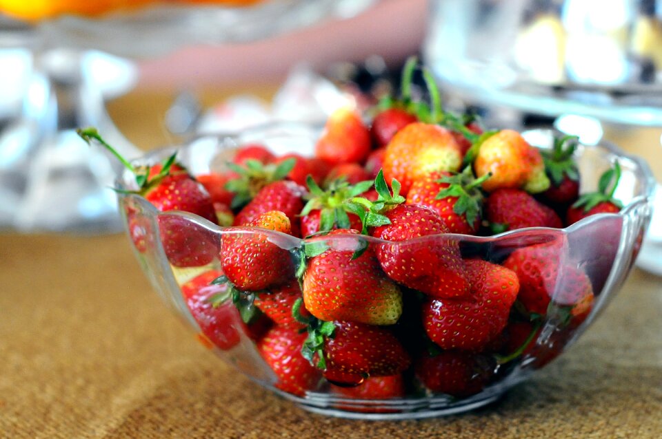 Red Strawberries in Clear Glass Bowl on Brown and Gray Textile