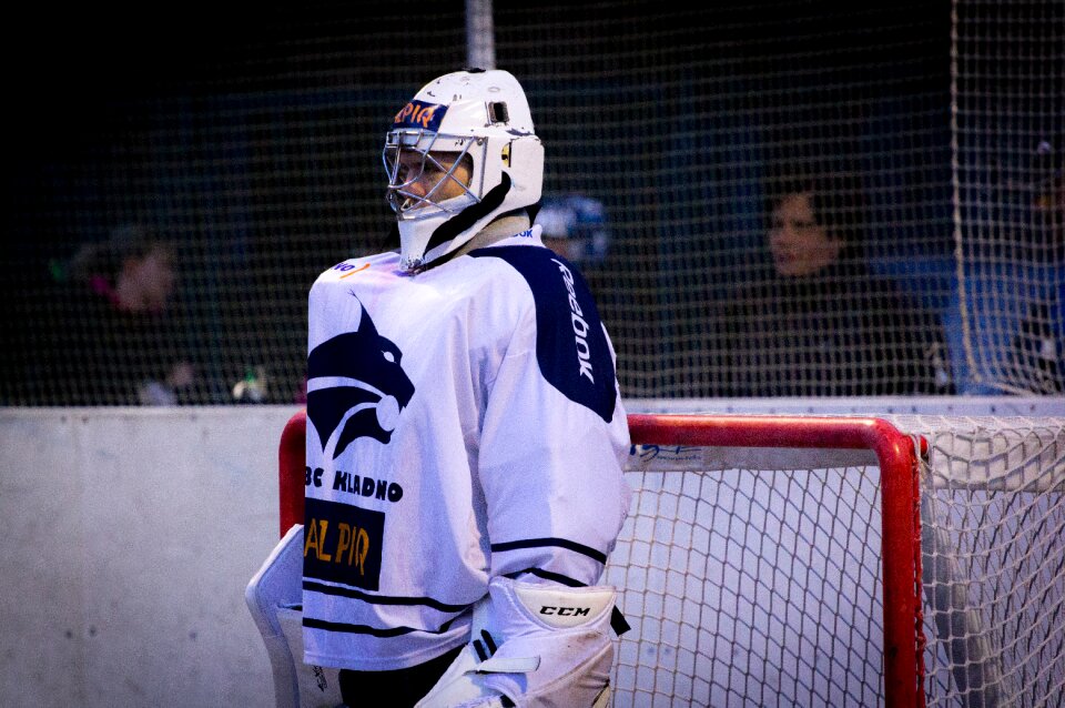 Man in White and Blue Jersey Shirt on Field