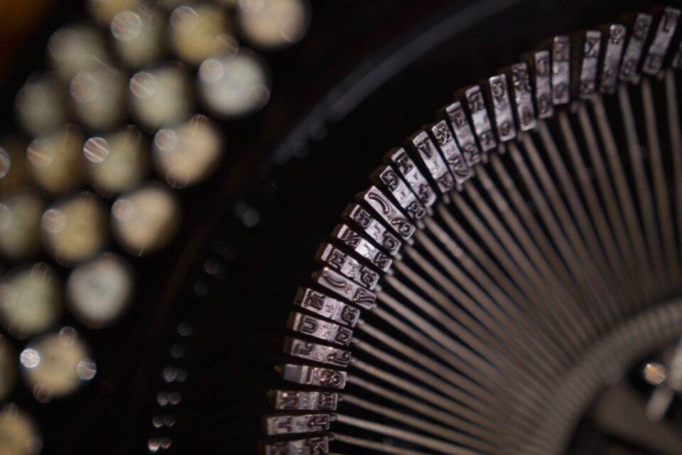 Black and Gray Typewriter in Close Up Shot