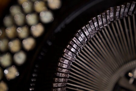 Black and Gray Typewriter in Close Up Shot photo