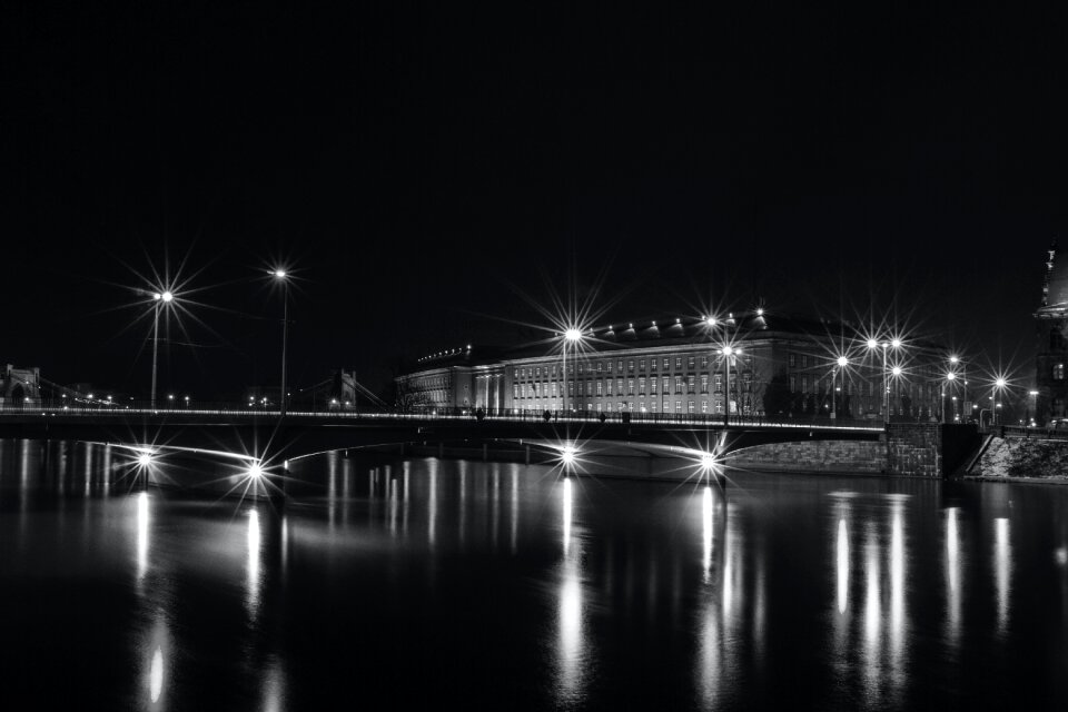 White Building Near Bridge With Lights