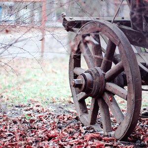 Brown Wooden Wheel on Land during Daytime