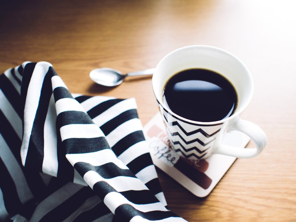 White and Black Chevron Ceramic Mug on Coaster photo