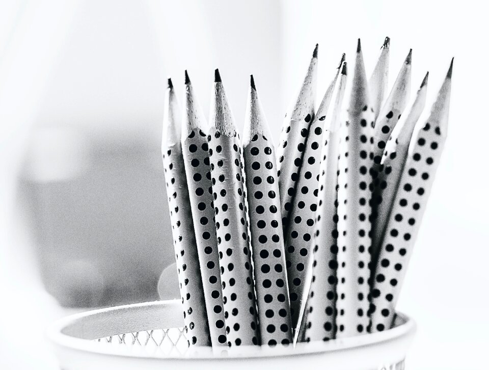 Grayscale Photography of Pencil Inside Round Basket