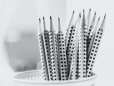 Grayscale Photography of Pencil Inside Round Basket