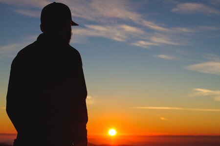 Silhouette of a Man With Sunset Fixture photo