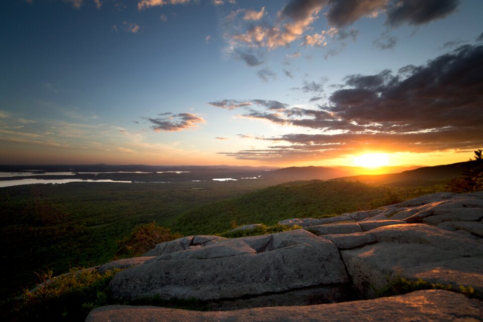 View of Green Grass Land and Sunset during Daytime photo