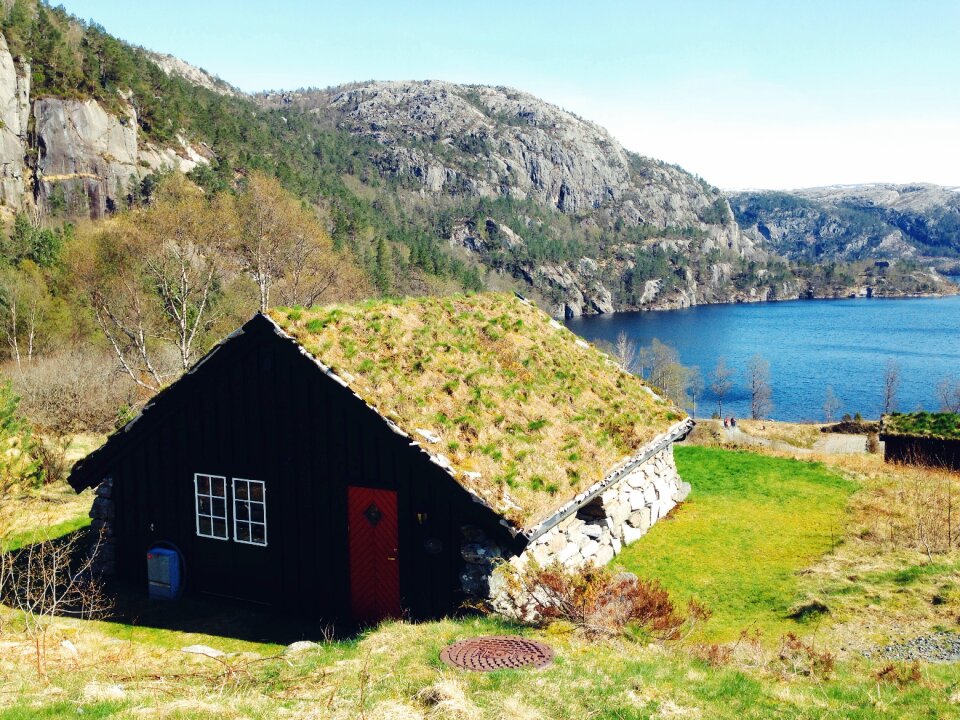 Green Brown and Red Wooden House on Green Grass