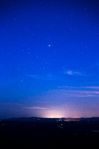 Silhouette of Mountain Range Under Stars photo