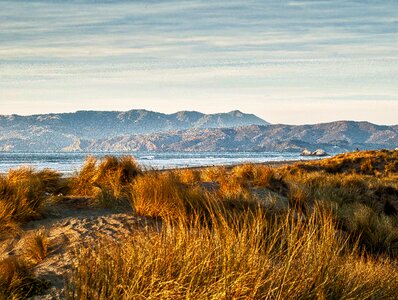 Brown Grass Near Mountains during Daytime photo