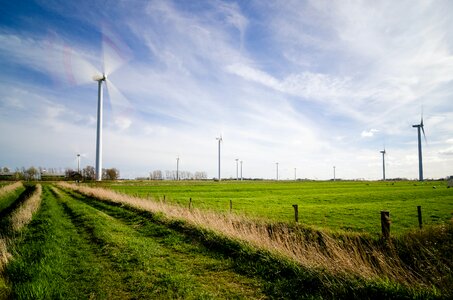 Wind Farm on Green Grass Pastures photo