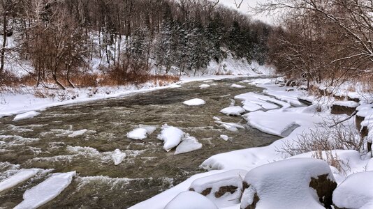 River Beside White Snow during Daytime photo
