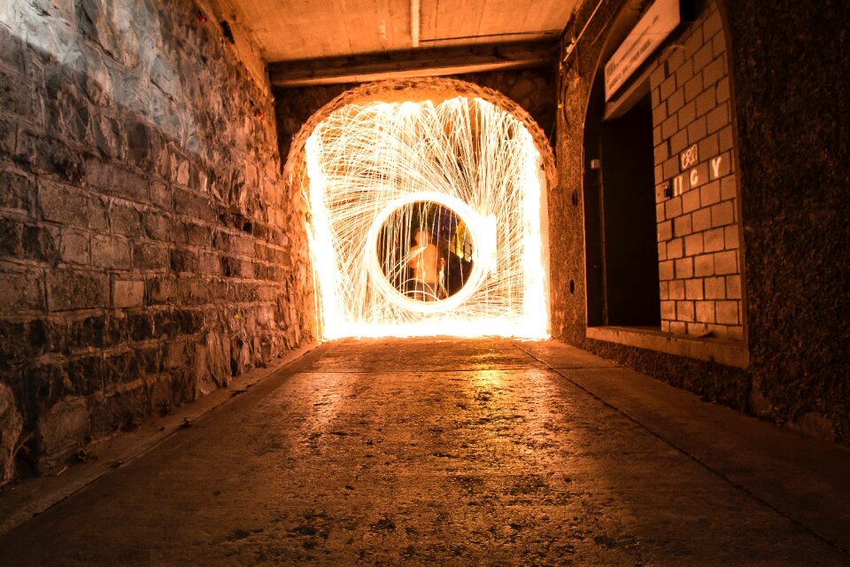 Timelapse Photo of Man in Hallway With Light