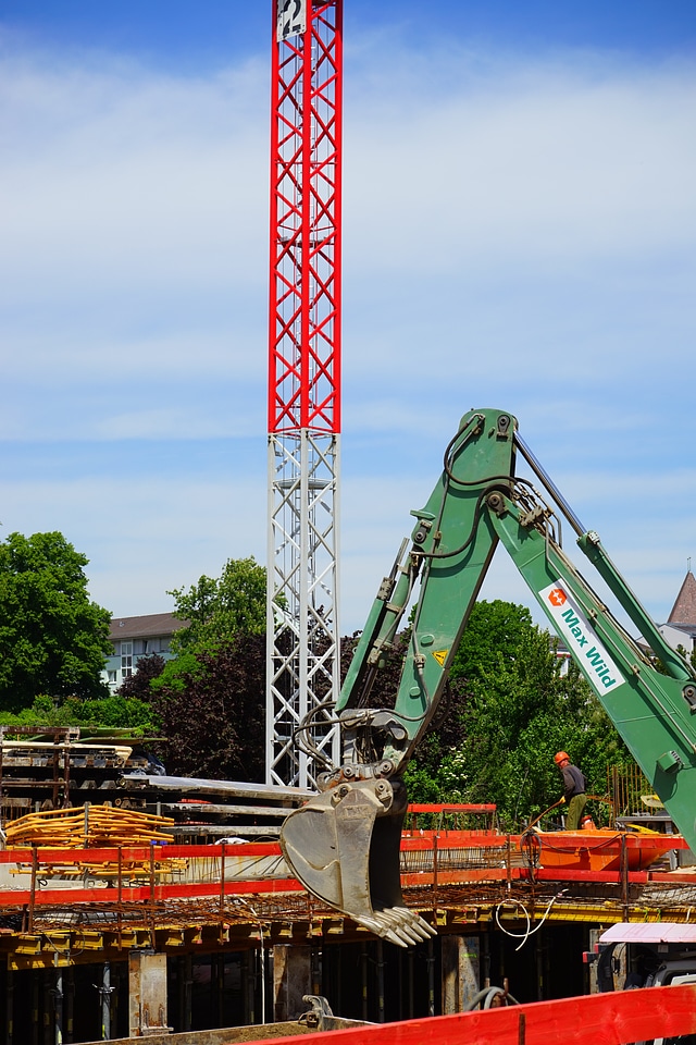Crane backhoe bucket construction workers