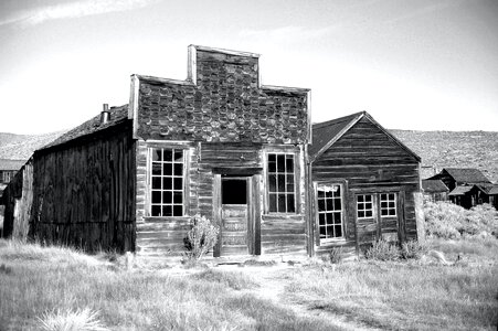 Gray Scale Photo of Brown Wooden House during Daytime photo