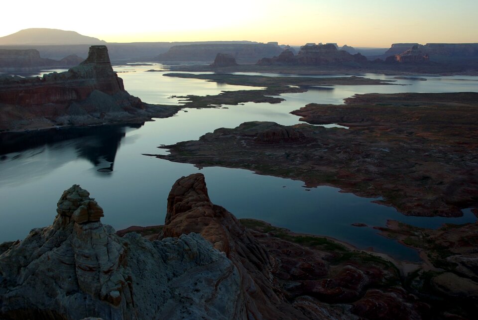 Brown Rock Formation in Between Body of Water during Golden Hour photo