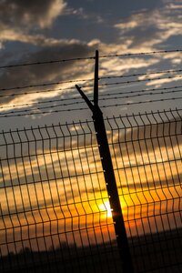 Gray Metal Fence during Sunset photo