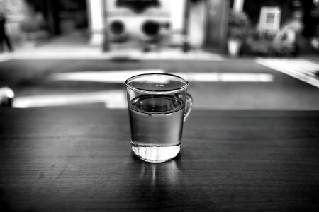 Gray Scale Photo of Glass With Water photo